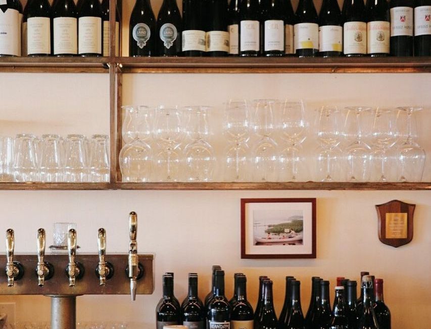 Mirabelle Wine Bar interior showing cozy seating and wine displays