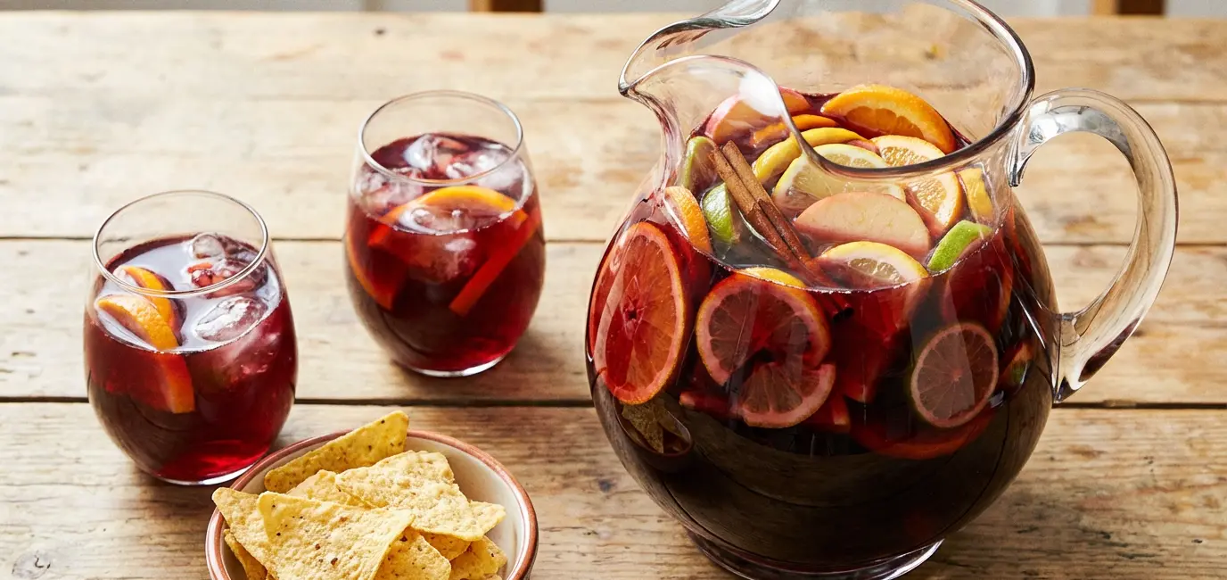 red wine sangria recipe for Cinco de Mayo with citrus and cinnamon sticks