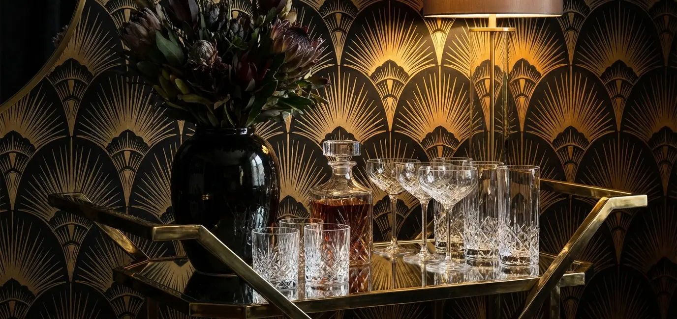 neo deco bar cart with geometric brass frame crystal glassware art deco wallpaper