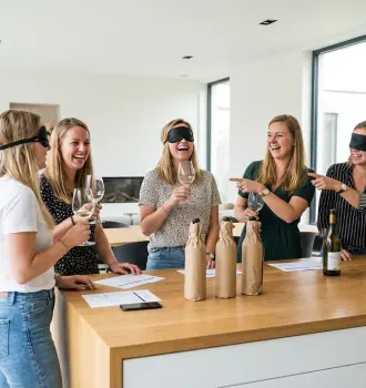 women wine tasting party friends enjoying wine blind tasting game fun
