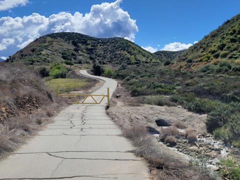 Fire road leading to Crafton Hills Reservoir and trail access to the Crafton Hills. 