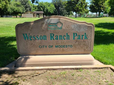 The park sign is in the southwest corner of the park near the intersection of West Union Avenue and Wesson Ranch Road. This view is towards the north.