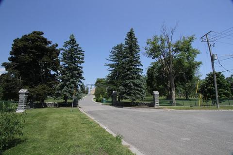 Little Lake Cemetery, view east toward northwest gate from Crescent Street, 13 June 2023