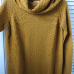 Featured thumbnail for Tricot avec grand col.