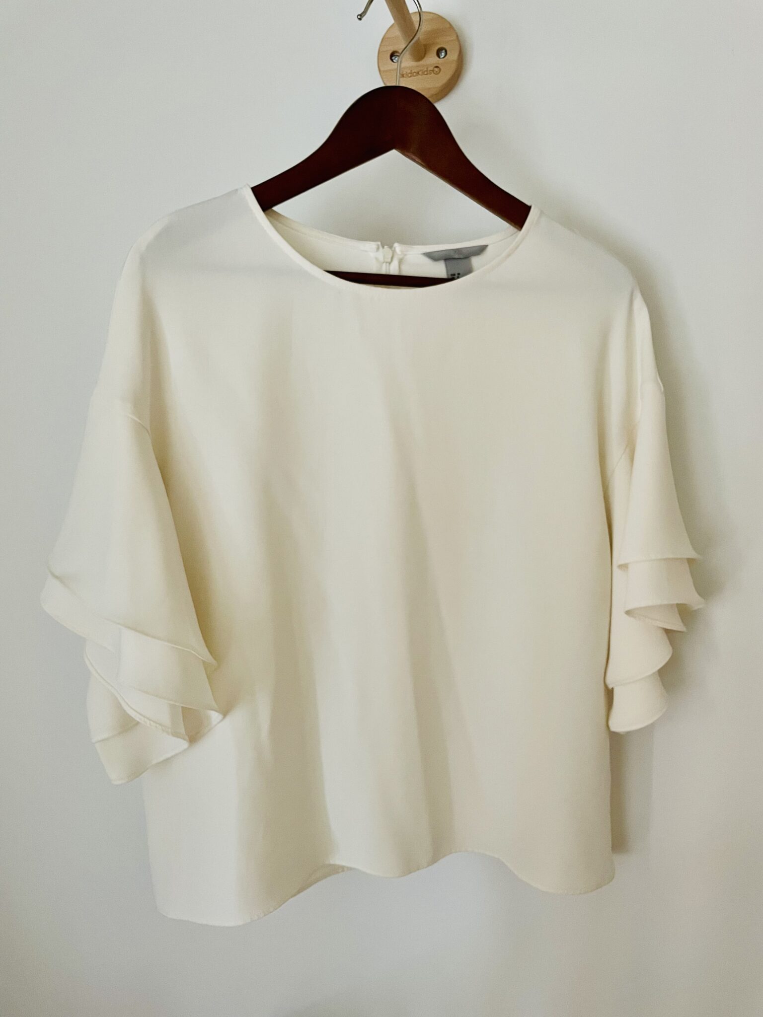 Featured image for Off white blouse with flounced sleeves