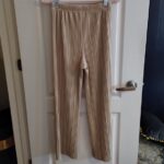 Featured thumbnail for Uniqlo beige pleated trousers