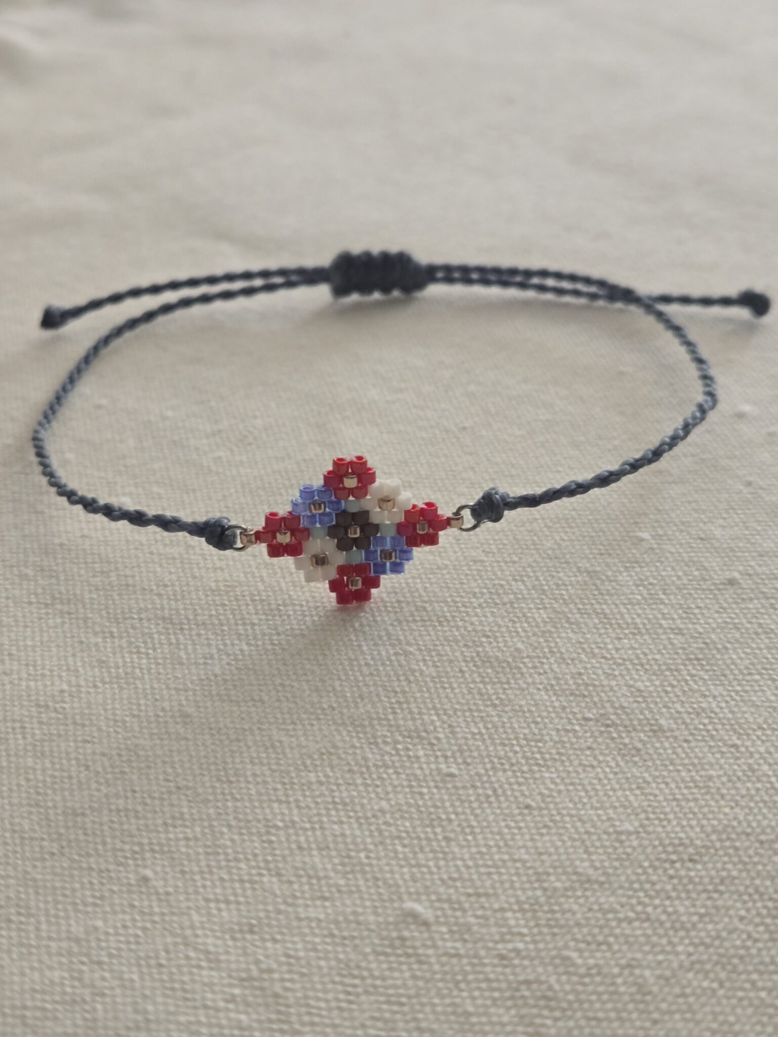 Featured image for SAGE BOHÈME adjustable bracelet in a weave of lossy flowers - blue-grey