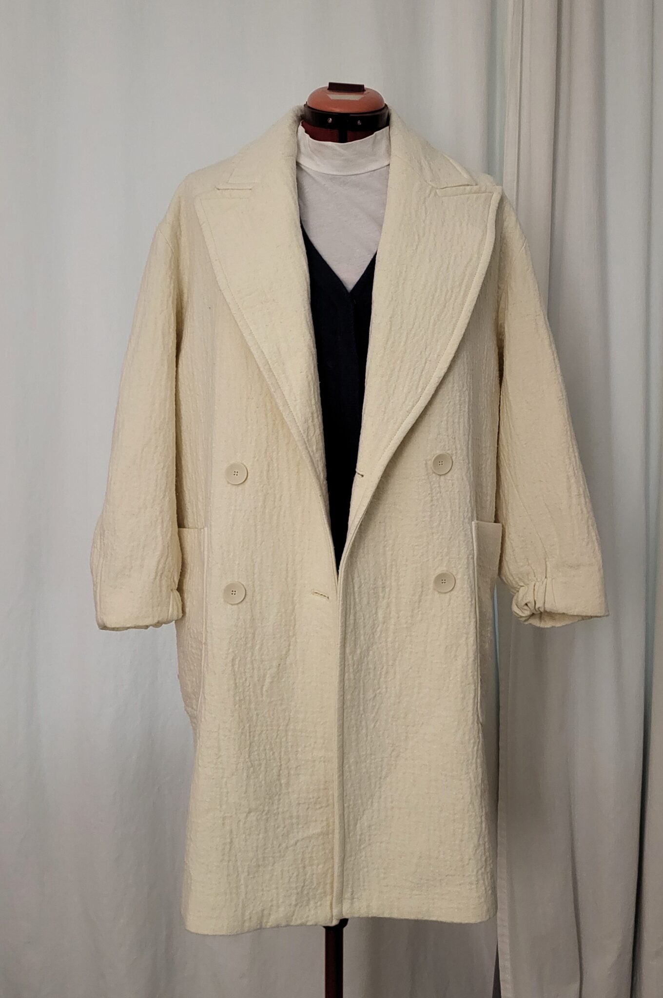 Featured image for Oversized mid-season coat in embossed cotton