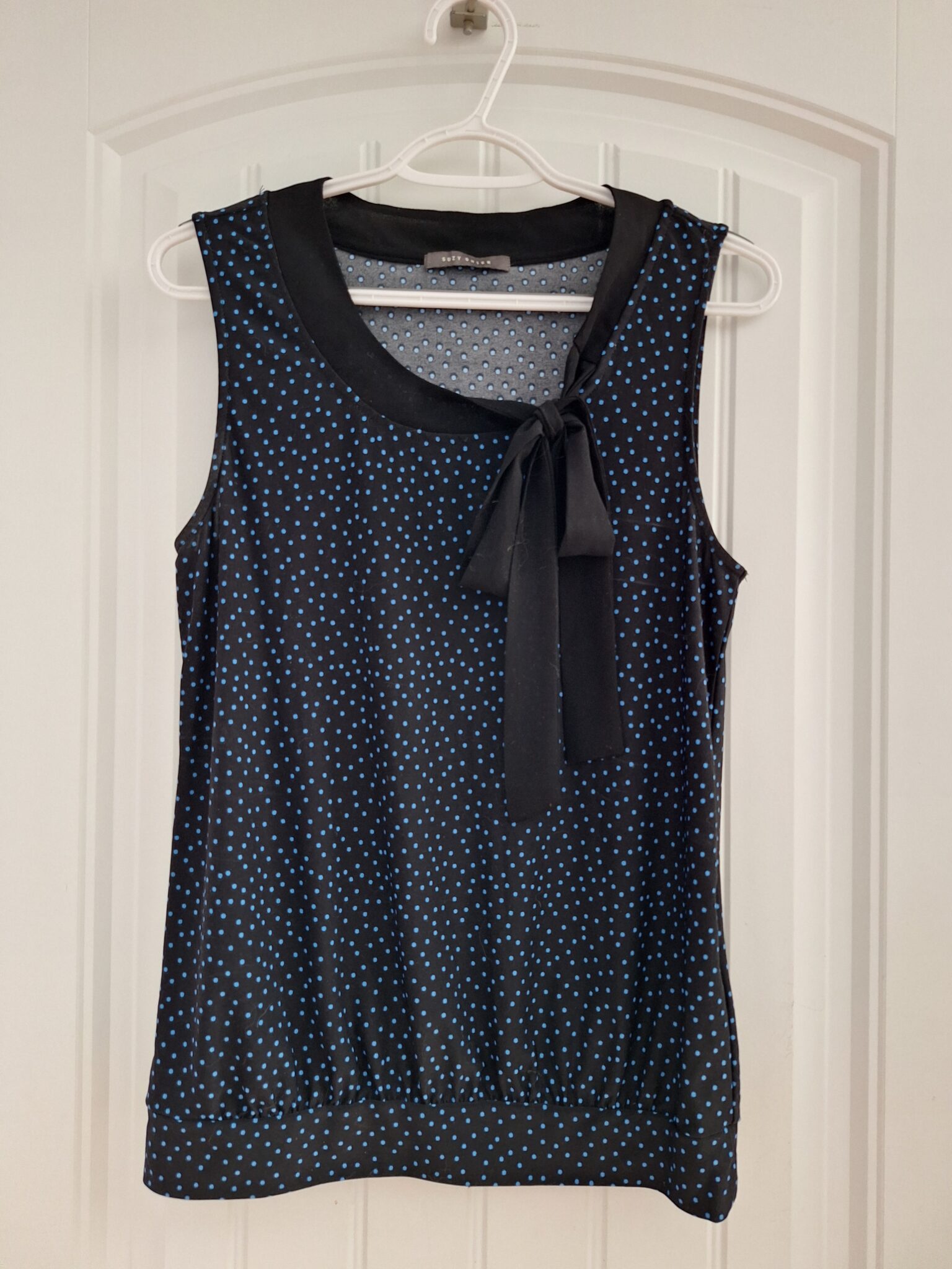 Featured image for Polka dot jumper with buckle