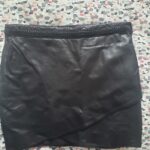 Featured thumbnail for Jupe noir cuir avec tressage