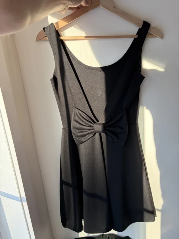Featured image for Short open back dress with bow