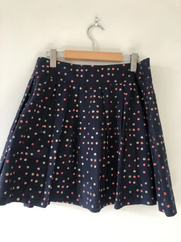 Featured image for Short pleated skirt with polka dots