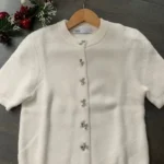 Featured thumbnail for Sweater-cardigan with buckle buttons