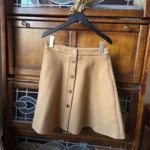 Featured thumbnail for Maje- Elegant A-line skirt in camel, 92% wool.