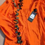 Featured thumbnail for Blouse orangée