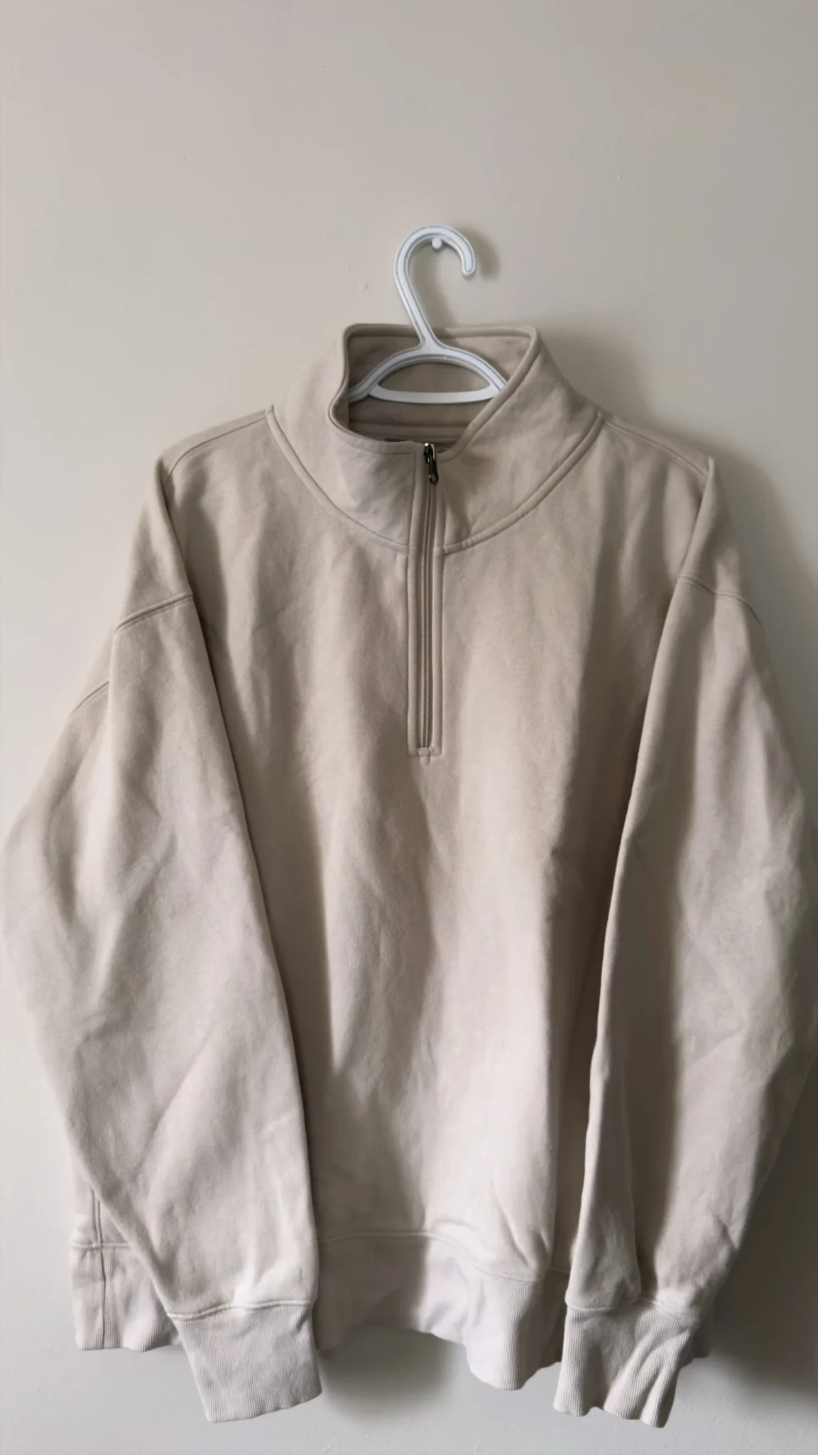Featured image for Chandail demi-zip manches longues beige