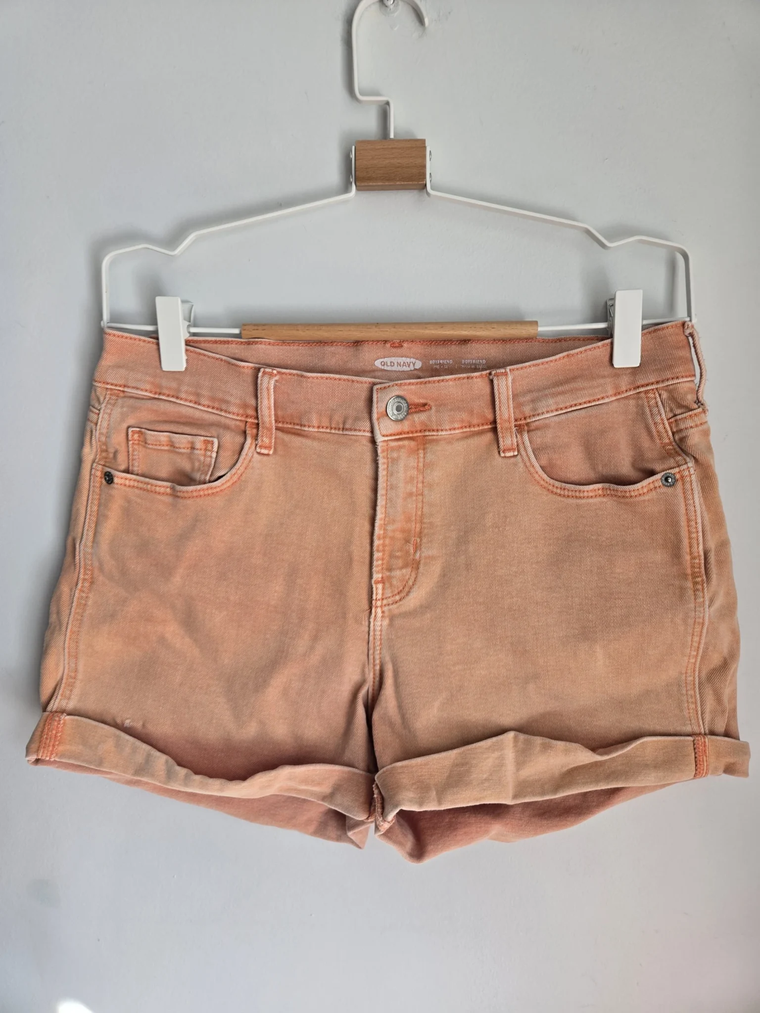 Featured image for Old Navy faded coral-orange denim shorts