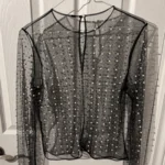 Featured thumbnail for Chandail filet avec perles et cristaux