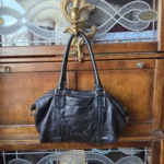 Featured thumbnail for Cole Haan-Magnificent black bag with baguette-style shoulder strap