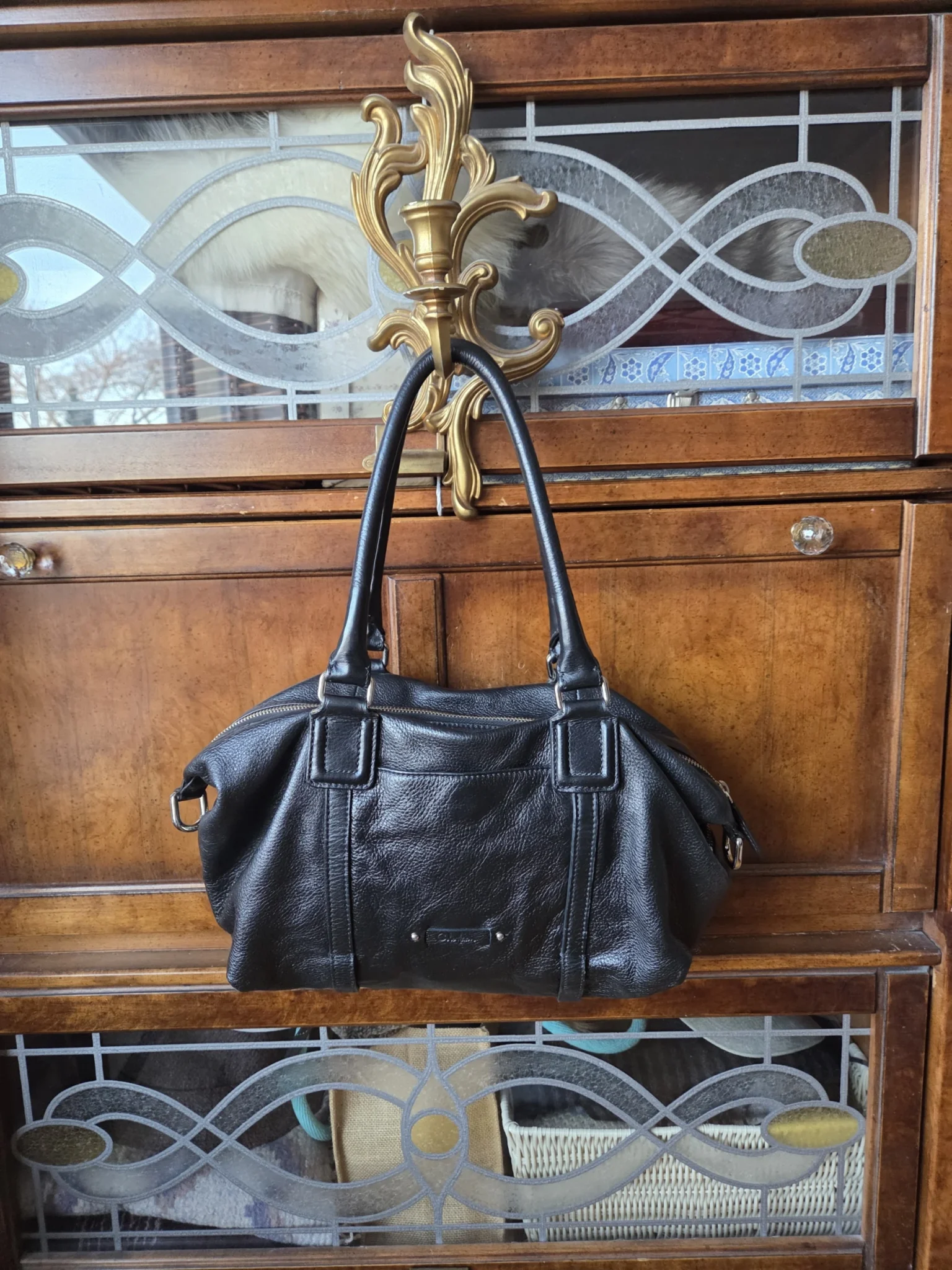 Featured image for Cole Haan-Magnificent black bag with baguette-style shoulder strap
