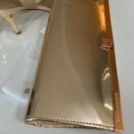 Featured thumbnail for Metallic clutch handbag