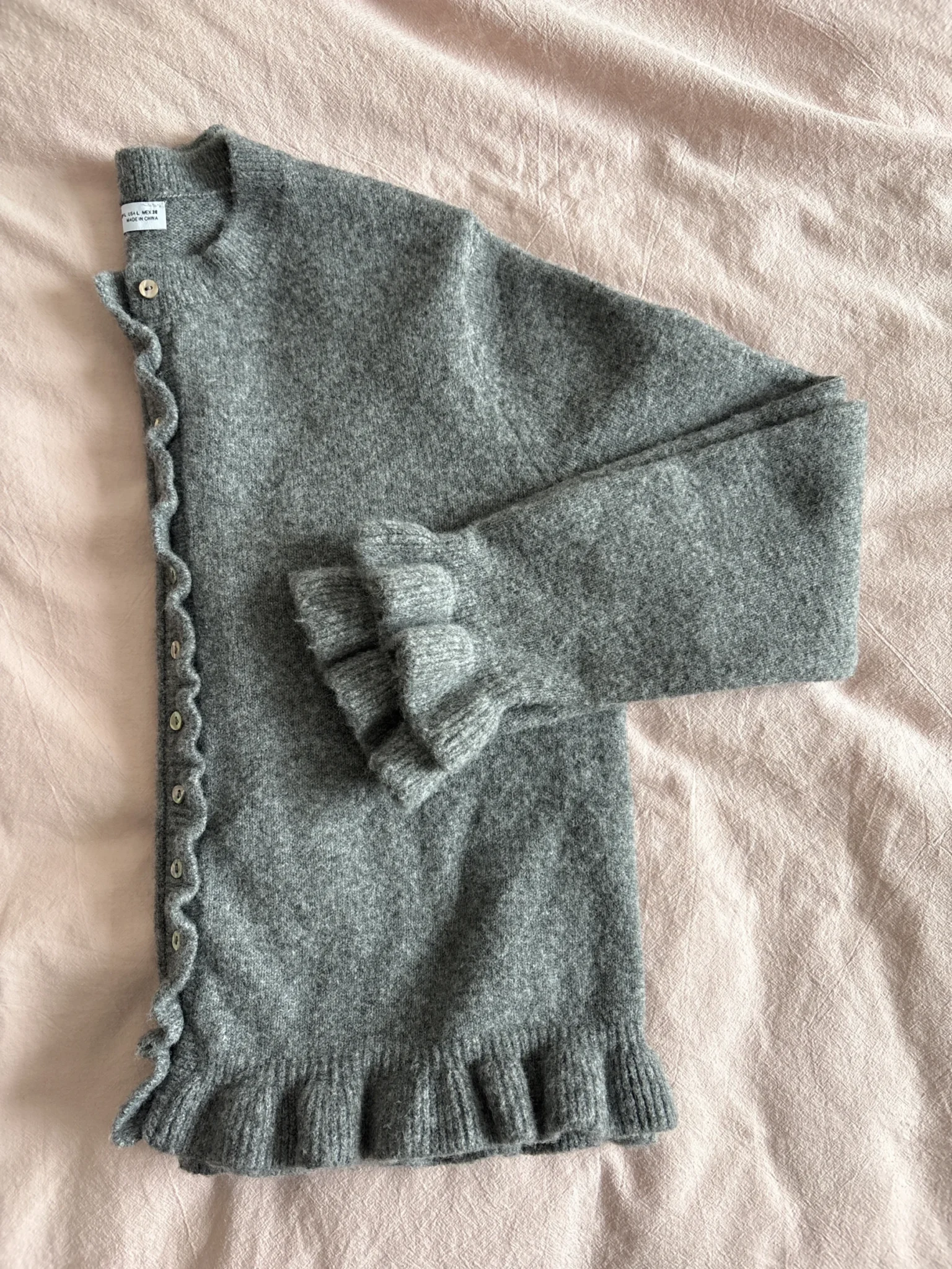 Featured image for Cardigan with ruffles