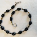 Featured thumbnail for Collier en onyx