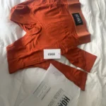 Thumbnail for Legging Hoaka orange brulé jamais porté
