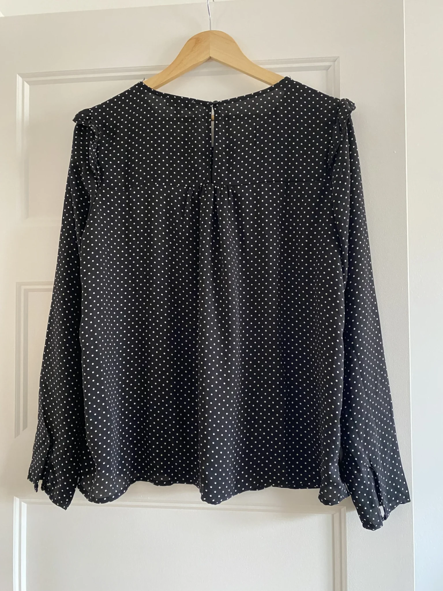 Image for Black blouse with white polka dots