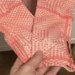 Thumbnail for Haut technique Kirkland Signature Demi-Zip – Corail – Taille Médium (M)