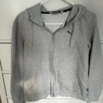 Featured thumbnail for Coton Ouaté Zippé Puma (Hoodie) – Gris Chiné – Taille Médium – Très Bon État
