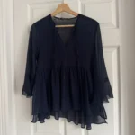 Featured thumbnail for Blouse marine fluide à rayures brillantes manches évasées