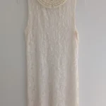 Featured thumbnail for Lace dress with jewelled collar