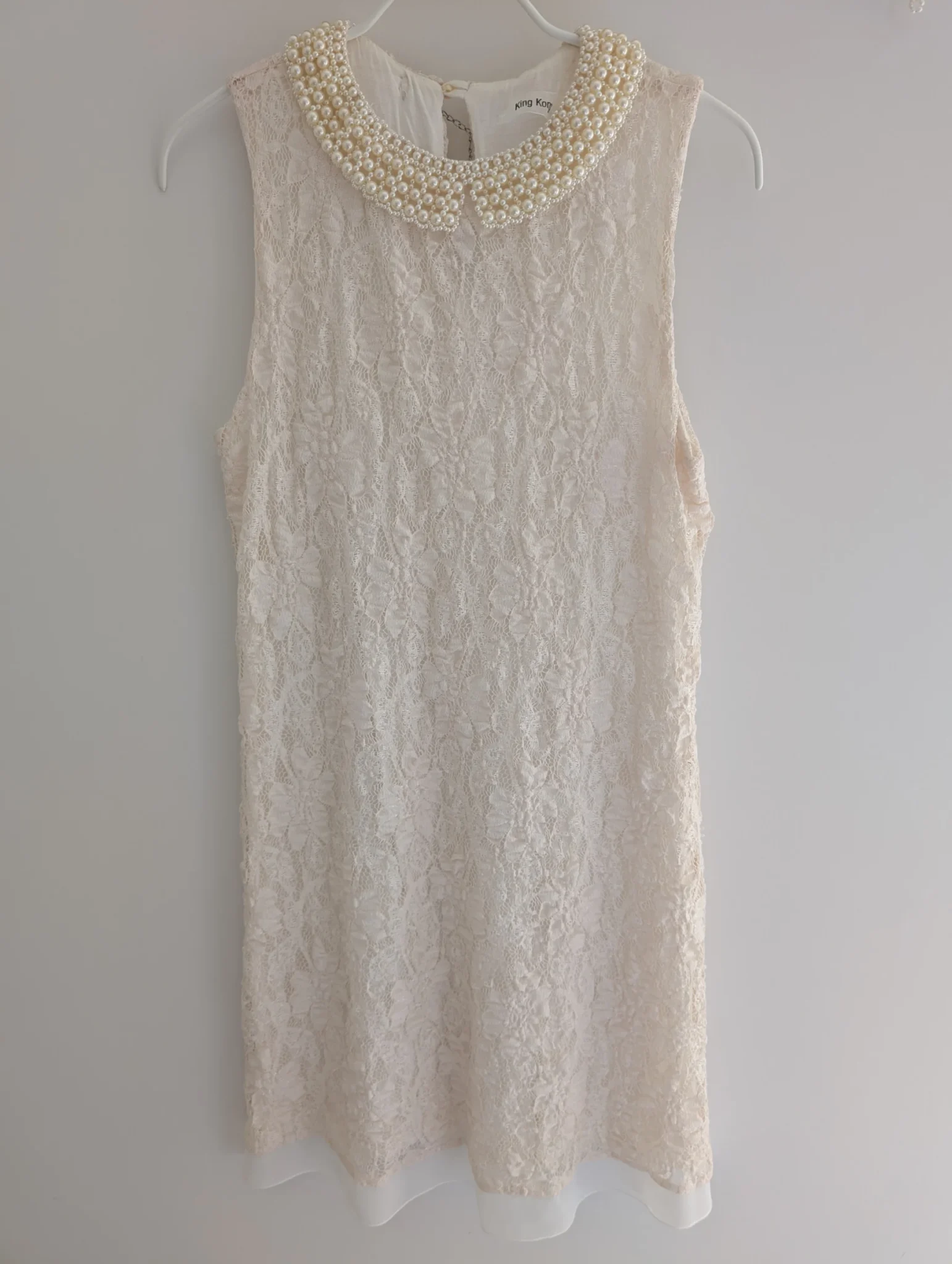 Featured image for Lace dress with jewelled collar