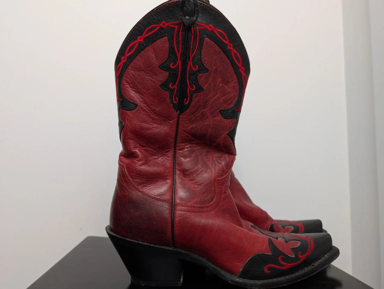 Featured image for Black and red leather cowgirl boots by Justin Boots