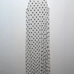Featured thumbnail for Robe longue blanche à pois noirs