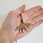 Featured thumbnail for Collier "mains de Jésus" en laiton de Marmo (anciennement MARMOD8)