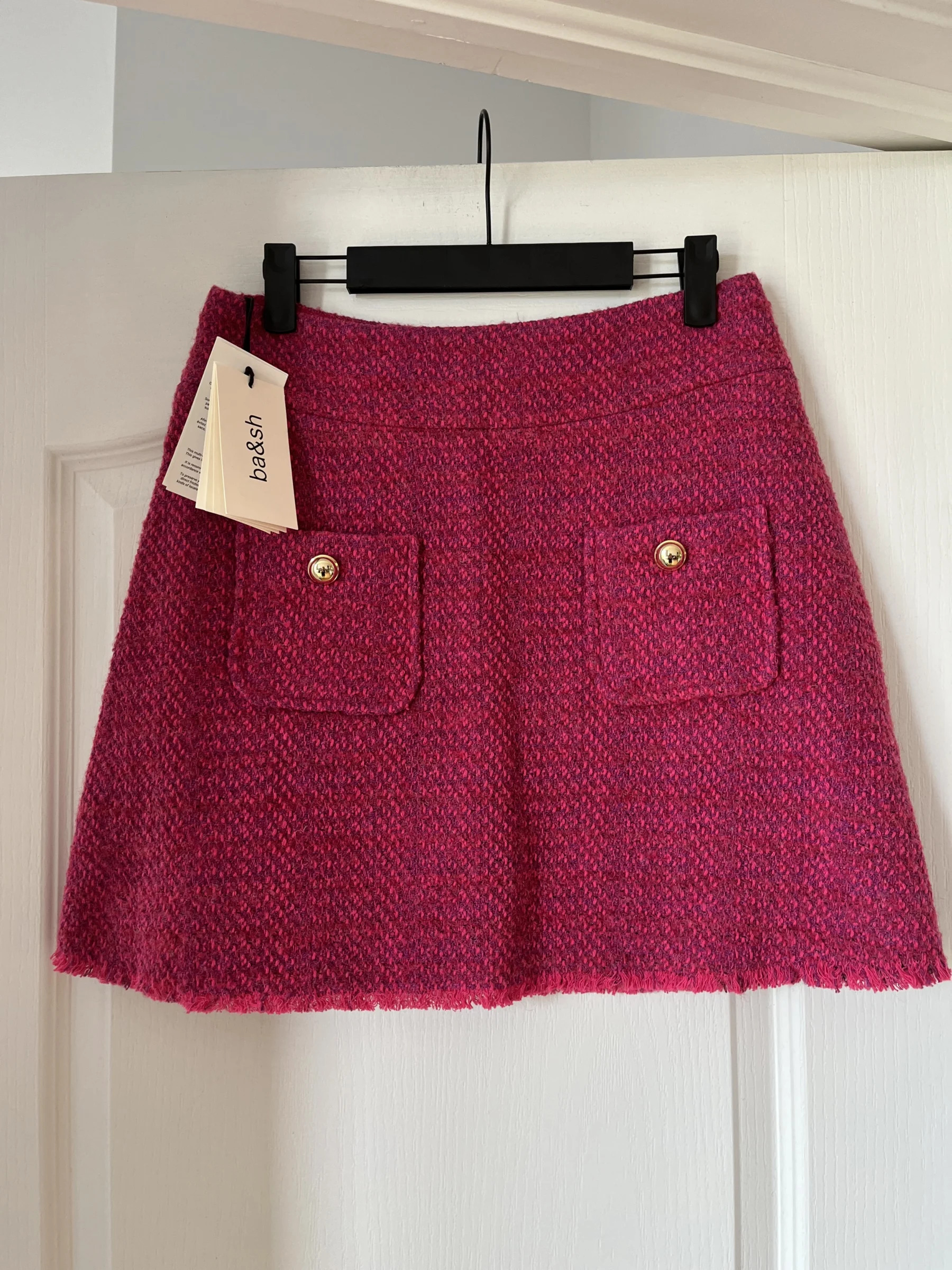 Jupe Bash rose en tweed en taille 40 neuf Bash seconde main