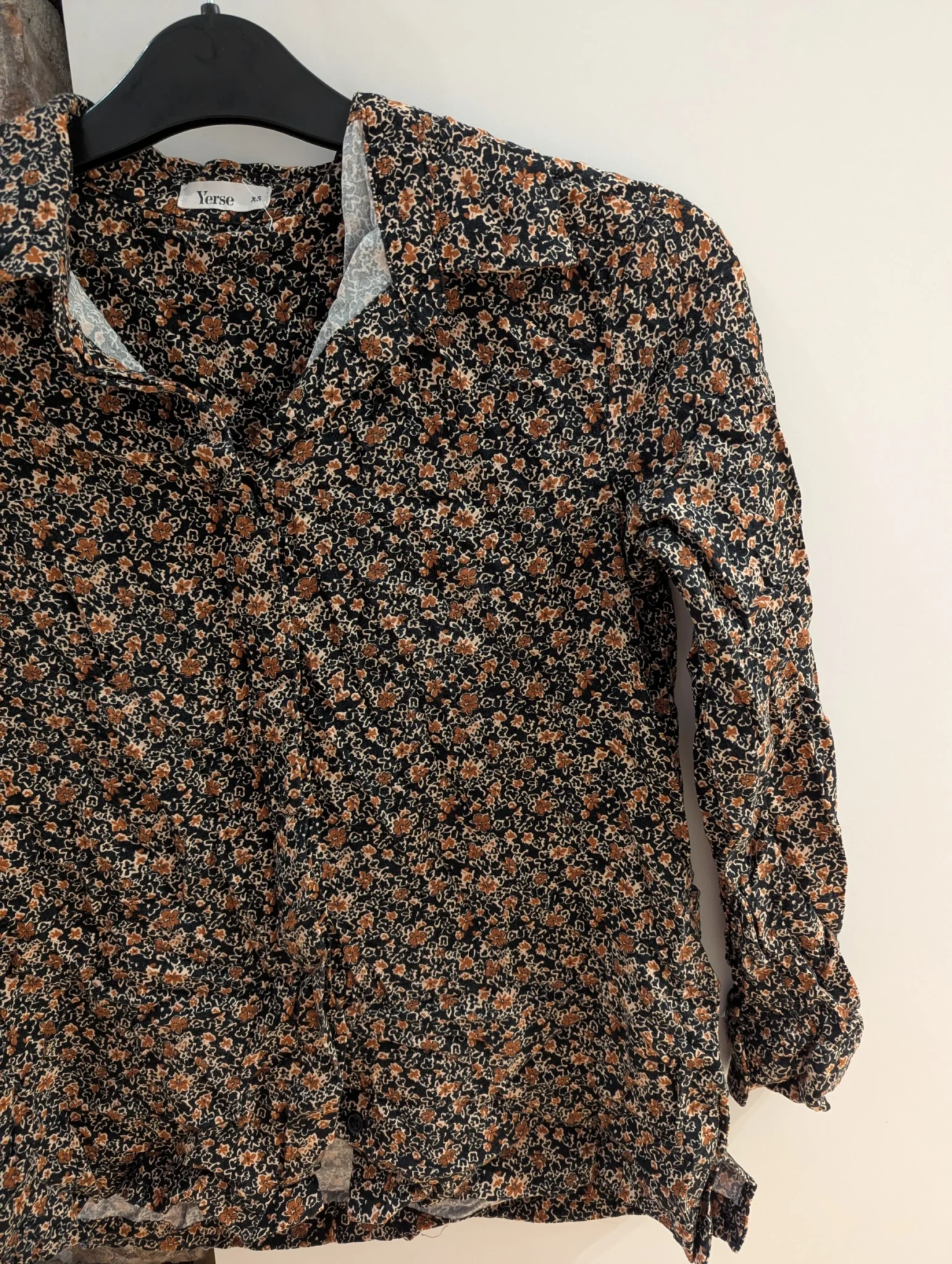 Featured image for Black floral blouse