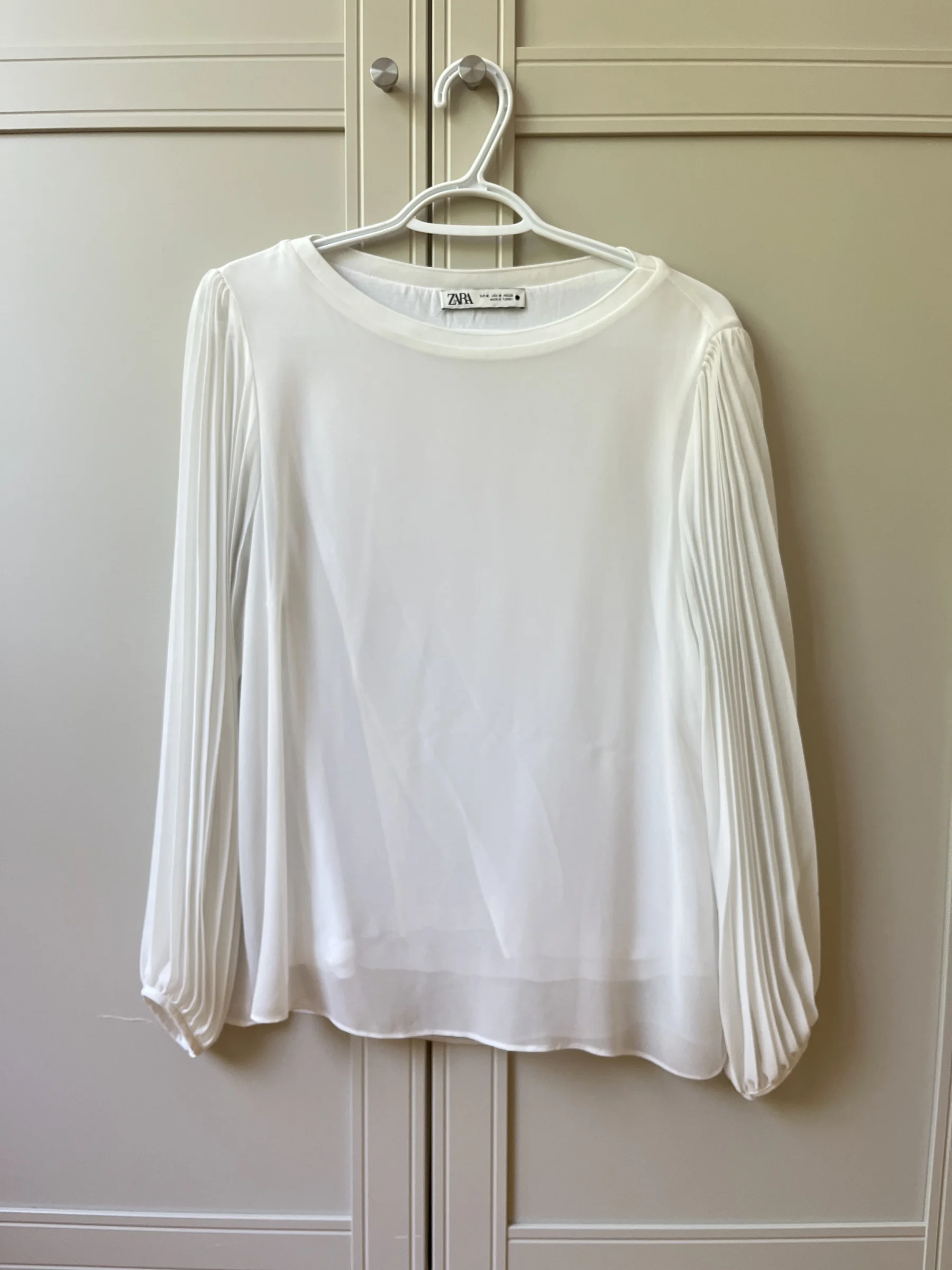 Chandail blanc lousse manches ballons transparente Zara seconde main