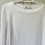 Thumbnail for White, loose-fitting top with sheer balloon sleeves