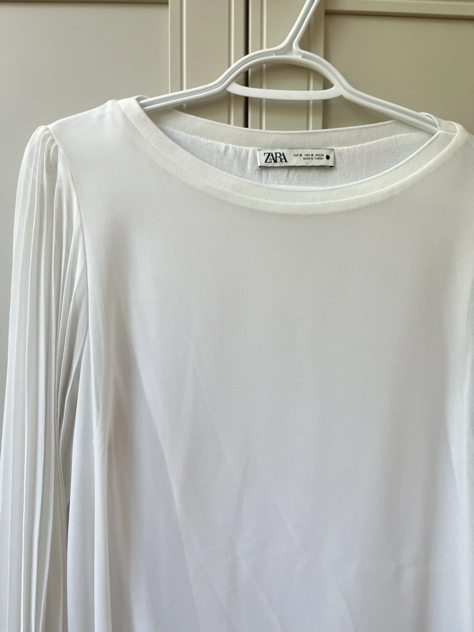 Image for White, loose-fitting top with sheer balloon sleeves