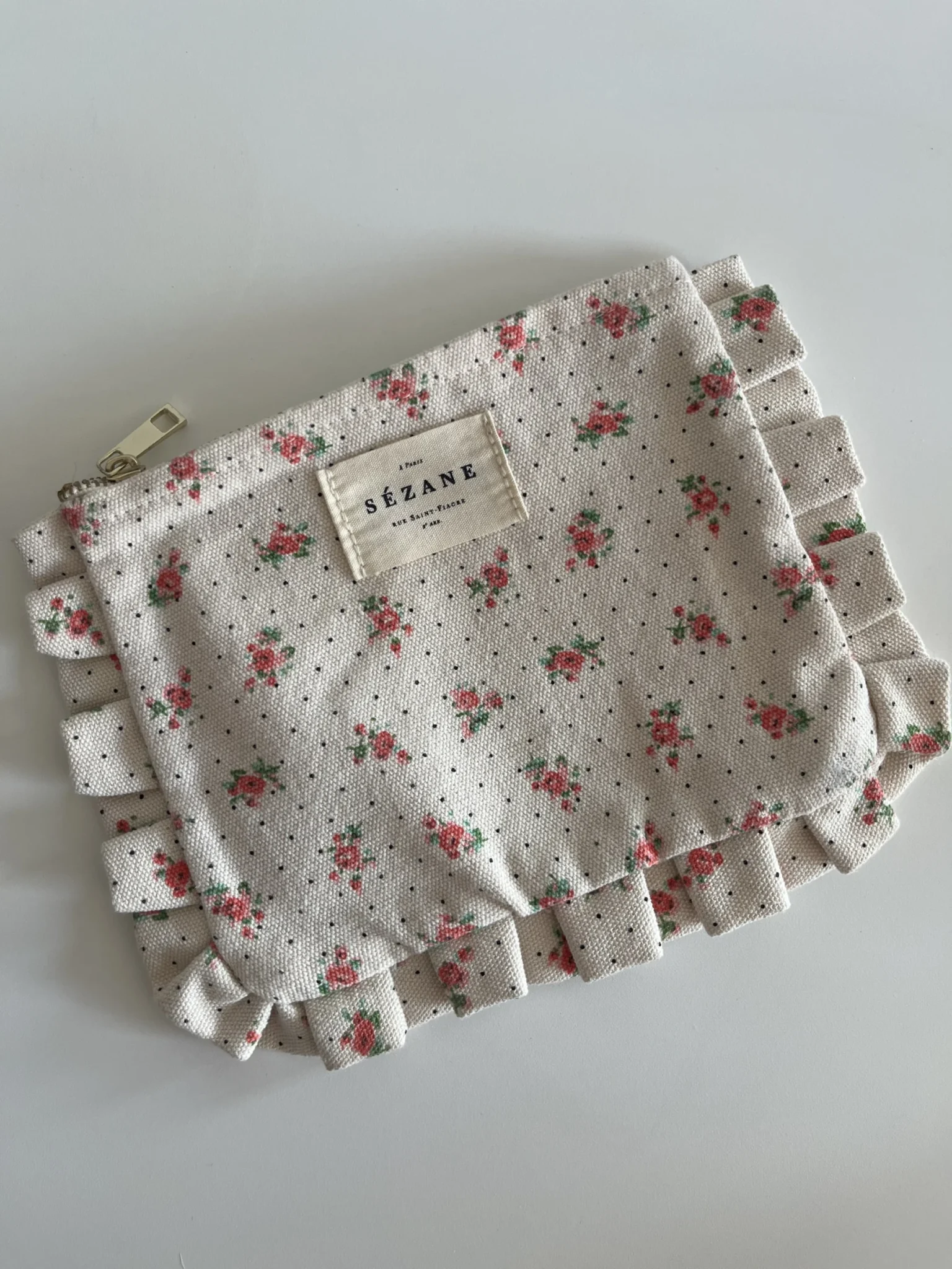 Featured image for Pochette Sézane beige fleuris rose
