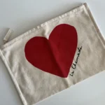 Thumbnail for Pochette Sézane La chamade beige et rouge