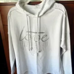 Featured thumbnail for A lovely white hoodie in a large size with an original slogan on the front.