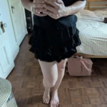 Featured thumbnail for Black frilly skirt with shorts underneath
