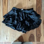Thumbnail for Black frilly skirt with shorts underneath