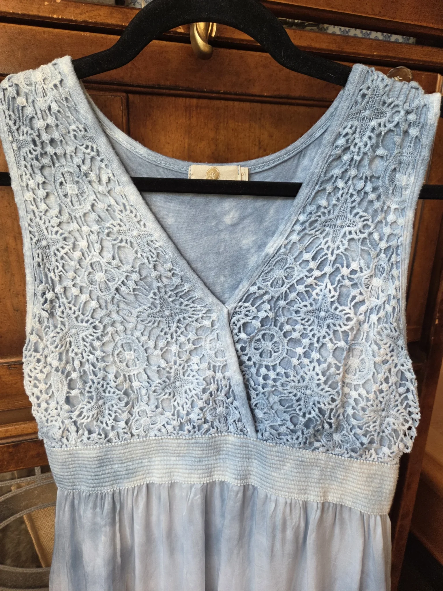 Image for A beautiful light blue sleeveless dress made from a silk blend