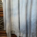 Thumbnail for A beautiful light blue sleeveless dress made from a silk blend