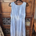 Thumbnail for A beautiful light blue sleeveless dress made from a silk blend